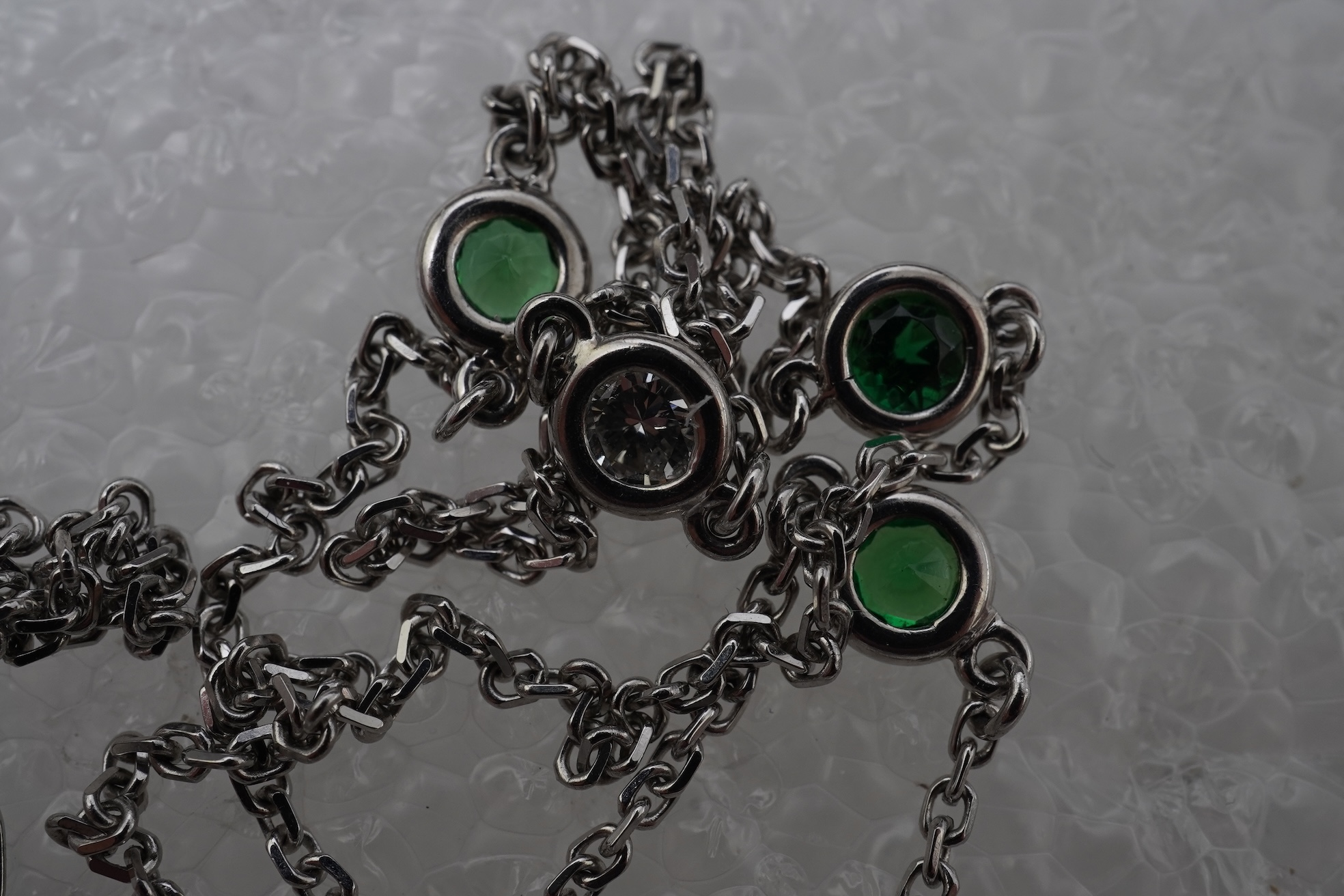 A diamond and tsavorite pendant necklace